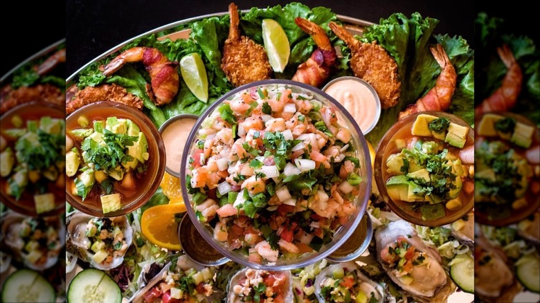 Large display of seafood on tray and glasses