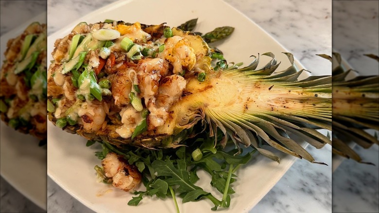 Shrimp mix on top of a sliced pineapple