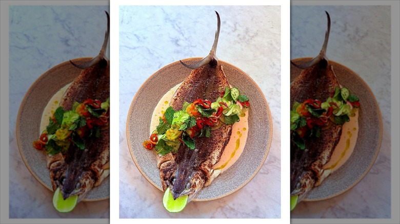 Whole fish on top of sauce
