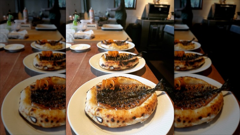 Row of fish baked into bread