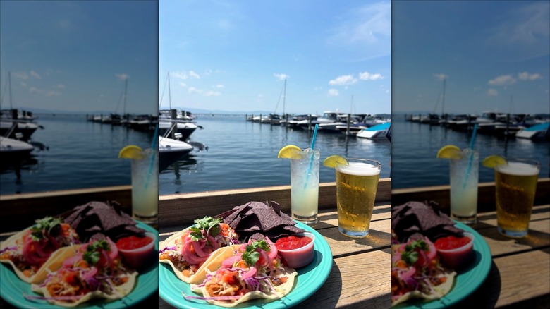 Seafood tacos on plate overlooking pier