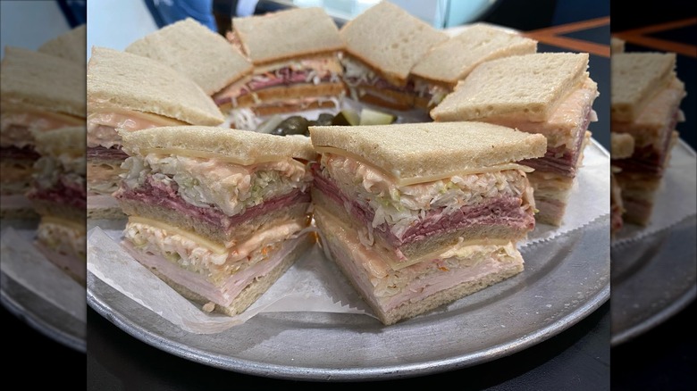 Town Hall Deli cold sandwich sloppy joes with white bride, sliced meat and cheeses, and lettuce