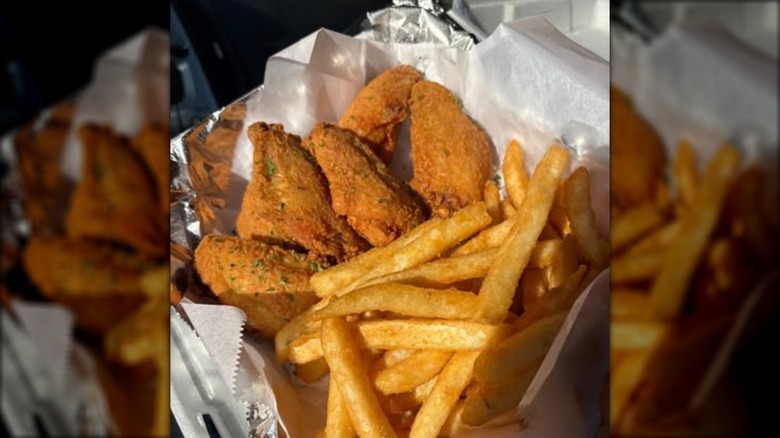 Triple A's Soul Food chicken and fries in styrofoam takeout box