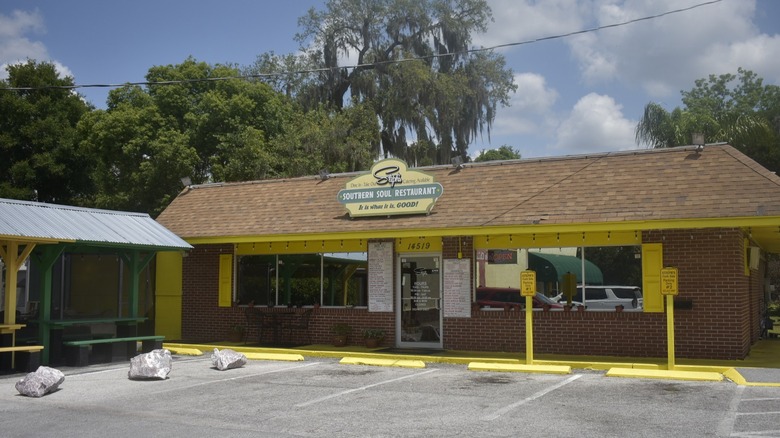 Steph's Southern Soul Restaurant storefront with yellow trimming in front of empty parking lot