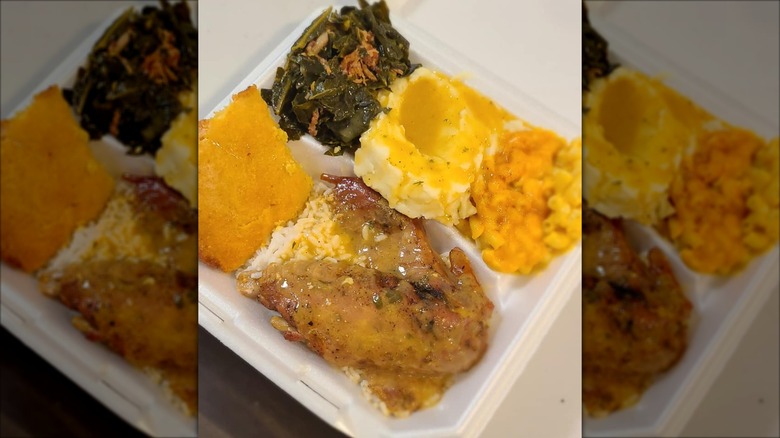 Soul Ties mac and cheese, rice, greens, potatoes, and cornbread in styrofoam takeout container