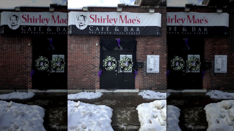 Shirley Mae's Cafe storefront in front of snowy sidewalk