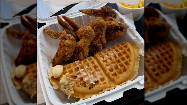 Gritz Cafe chicken and waffles in styrofoam to go container