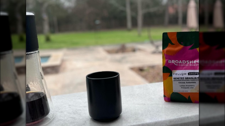 Coffee, a mug, and a coffee pot positioned on a counter