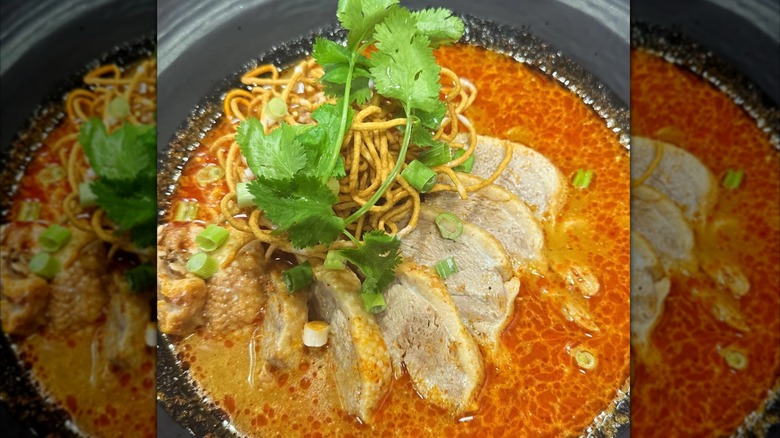 Duck Khao Soi Thai dish with slices of roasted duck with curry noodle Soup at Lemongrass Thai Cuisine Restaurant