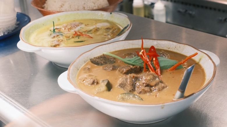 two bowls of kaeng Thai curry in Lom Wong restaurant kitchen