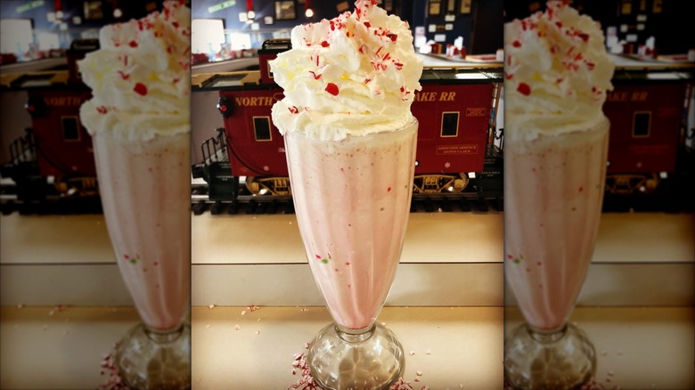 Tyler's Tender Railroad Restaurant Peppermint Shake with model trains in the background