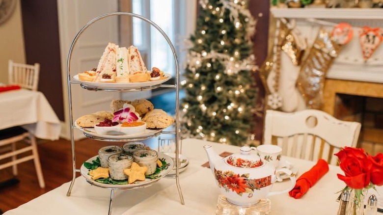 Interior dining room with tea setting at The Mad Hatter Tea House