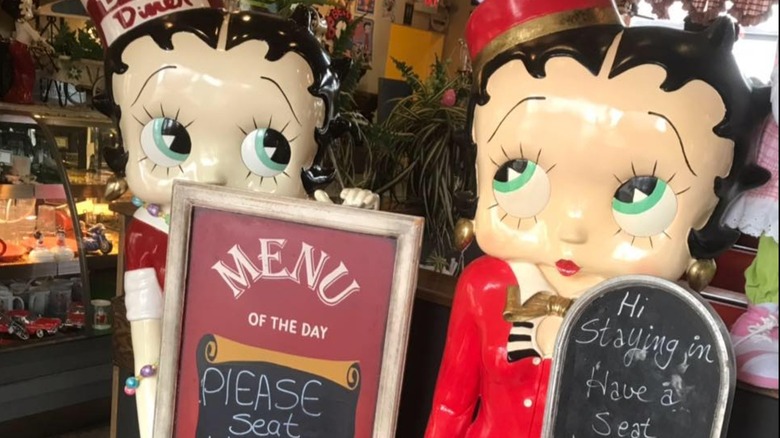 Beez Holgate Station wait to be seated area with Betty Boop manequins