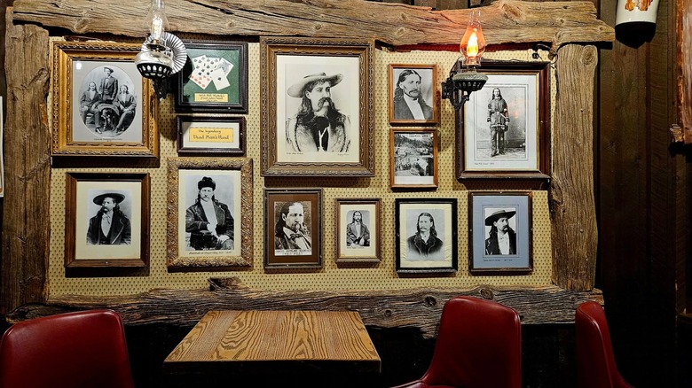 Old Style Saloon No. 10's interior with a gallery wall of Old West photos