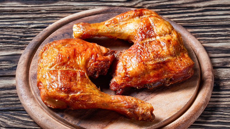 Plate of rotisserie chicken leg quarters