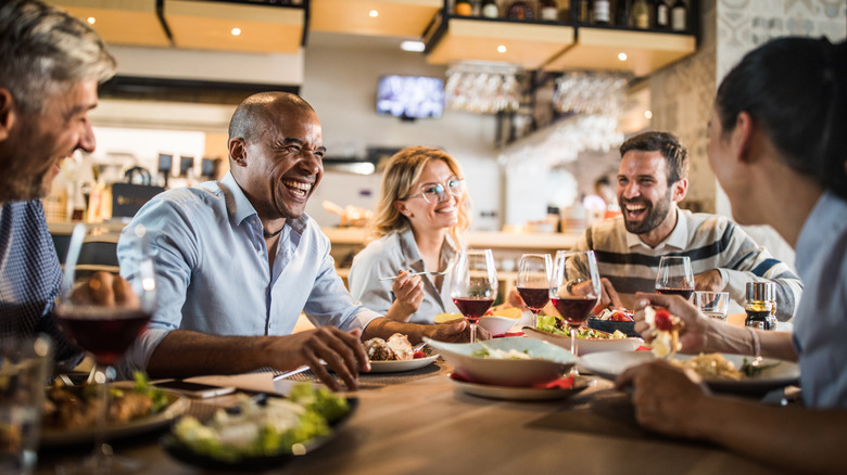 People having lunch together at a restaurant