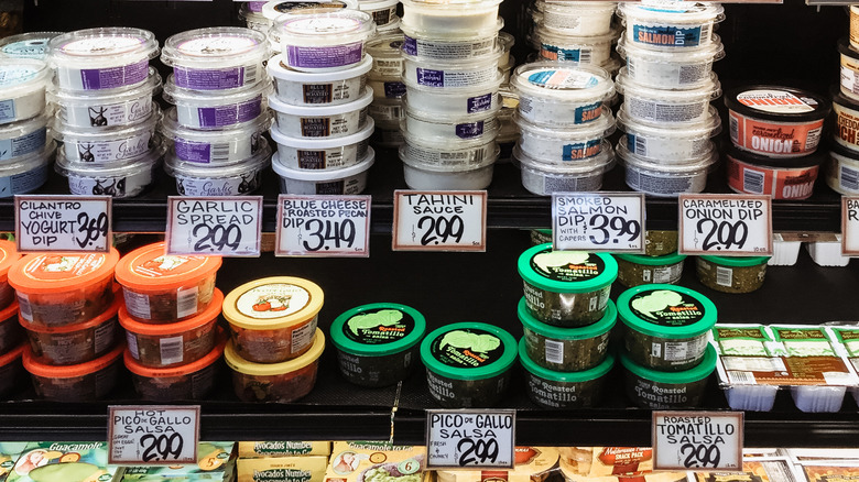 Assorted dips on Trader Joe's refrigerated shelf