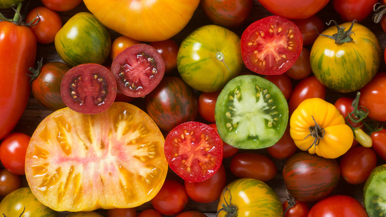 Assorted whole and halved heirloom tomatoes