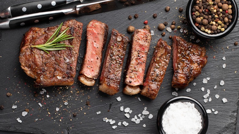 sliced steak with finishing salt and pepper