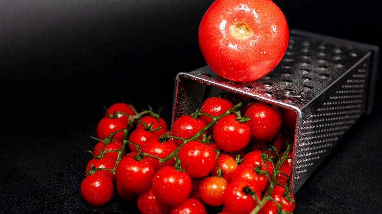 Tomatoes on and inside box grater