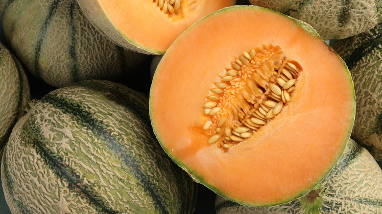pile of halved and whole cantaloupes