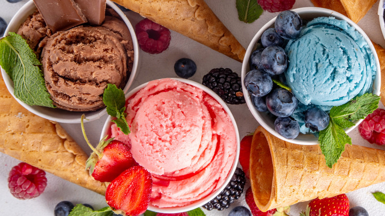 Colorful ice cream with berries and mint leaves