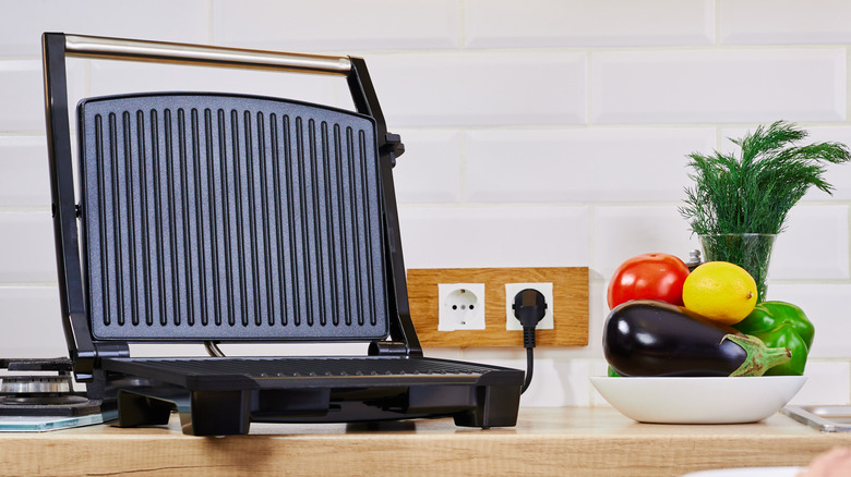 A panini press on a counter.
