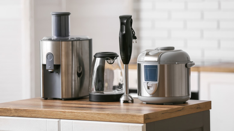Various kitchen appliances sitting on a kitchen island.