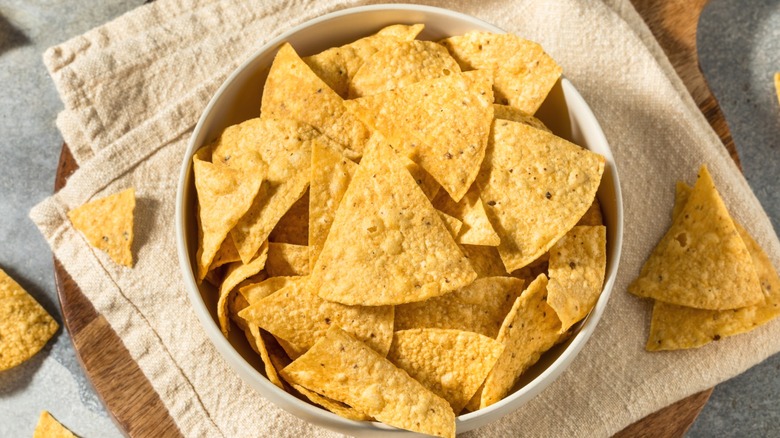 Homemade tortilla chips in a large bowl.