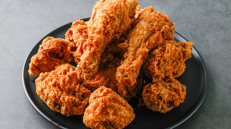 fried chicken on a black plate