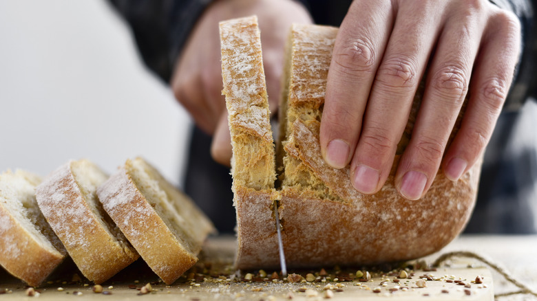 Man slicing bread