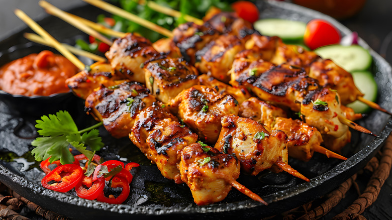grilled chicken skewers with red salsa