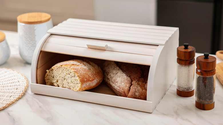 homemade bread stored in wooden breadbox