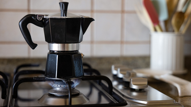 A moka pot on the stove