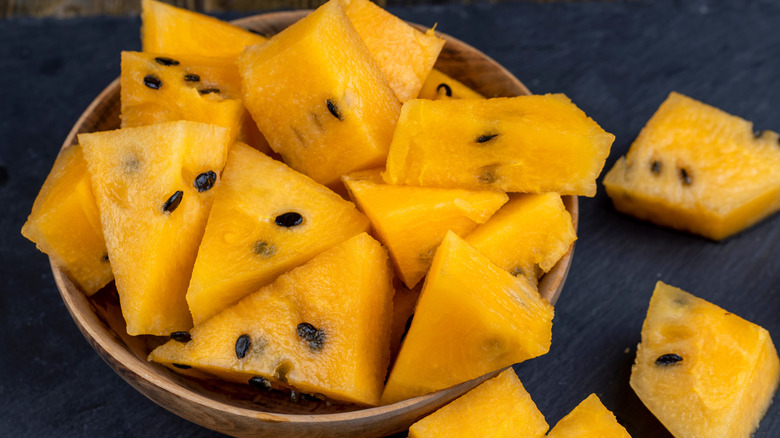 Wooden bowl of orange watermelon pieces