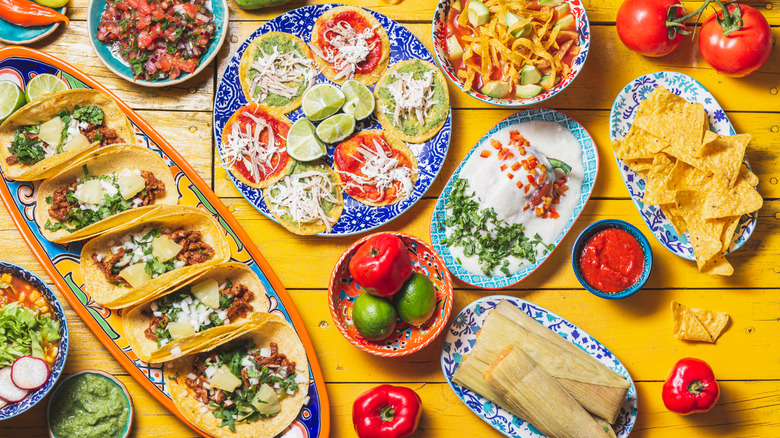 Overhead shot of color dishes filled with various traditional Mexican dishes