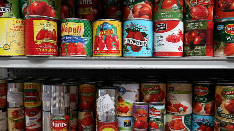 various brands of canned tomatoes in pantry