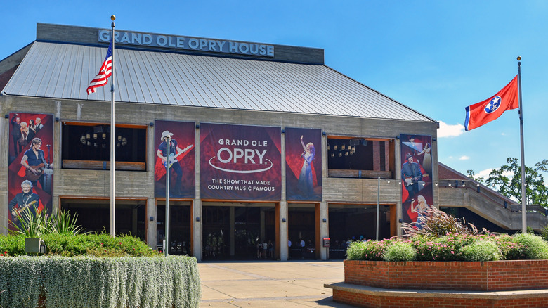 Exterior of Grand Ole Opry House with American flag flying on pole