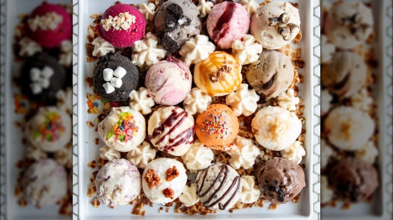 16 colorful scoops of ice cream on a plate.