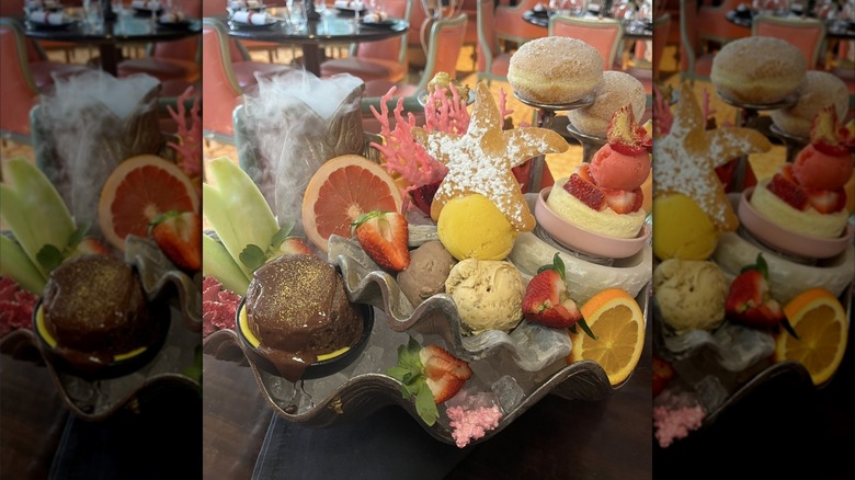 A dessert platter with small pastries, ice cream, and decorations.