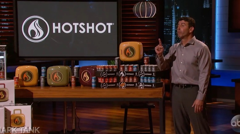 Danny Grossfeld next to a HotShot display on Shark Tank