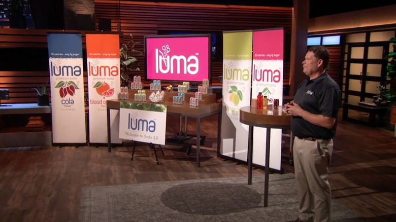 Jim Otteson next to his Luma Soda display on Shark Tank