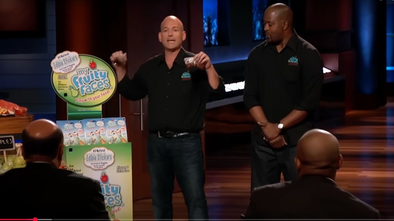 Adam Gerber and Bob Ntoya next to their Mr. Fruity Faces display on Shark Tank