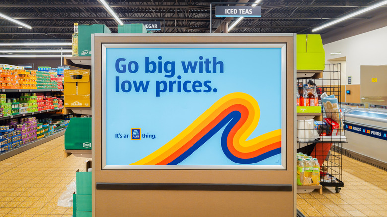 An endcap inside Aldi advertises low prices