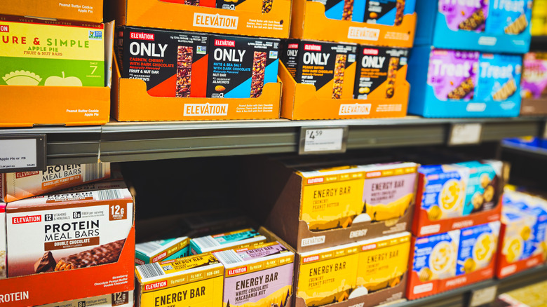 Protein bars of different brands on Aldi shelves