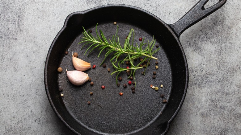 A cast iron pan with aromatics for a sautee.