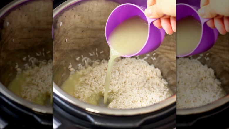 Pouring broth into pot of rice