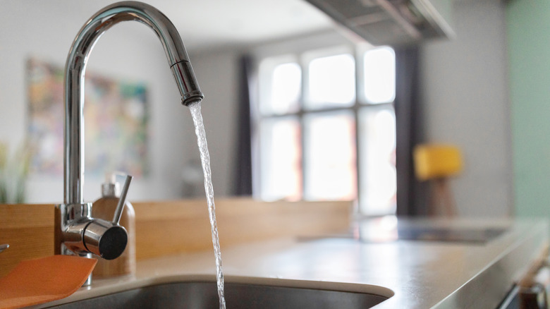 Kitchen sink with running water