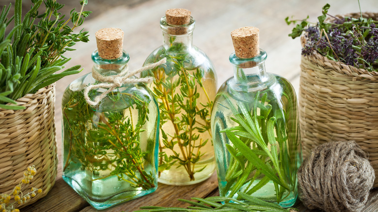 Glass bottles of herb-infused oils
