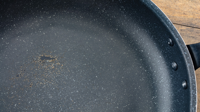 Damaged nonstick pan with a peeling coating